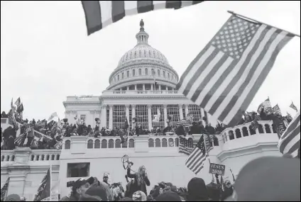  ?? ASSOCIATED PRESS FILES ?? Supporters of President Donald Trump gather last week outside the US Capitol in Washington. Jewish-Americans and experts who track discrimina­tion are alarmed by the amount of anti-Semitic symbols and sentiment that was visible during the skirmish.