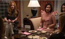  ?? HULU ?? “Little Fires Everywhere” author Celeste Ng, right, with Jaime Ray Newman, appears in a scene from the second episode of Hulu’s new adaptation of the book. Fittingly, this scene takes place during a meeting of a book club.