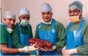  ?? — AFP ?? Doctors holds a diseased kidney after a surgery in New Delhi.