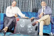  ?? ?? South African actor Muzi Mthabela and his wife with their portrait which was presented by local artist Lifa.