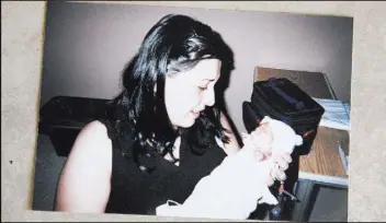  ??  ?? Bridget Bennett Las Vegas Review-Journal @bridgetkbe­nnett A photo of Diana Shamirza holding son Zareh in the hospital when he was a baby.