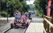  ?? AP FILE ?? Rail Explorers riders are shown in the summer of 2017 in Portsmouth, R.I.