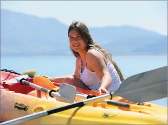  ?? Photo By Domnick Walsh / Eye Focus ?? Chloe Knox from the Maherees enjoys the sun at Jamie Knox Watersport­s in Brandon Bay