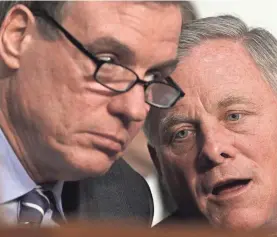  ?? ALEX WONG/GETTY IMAGES ?? Members of the Senate Intelligen­ce Committee credited leaders Richard Burr, right, and Mark Warner with maintainin­g openness.