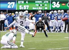  ?? Associated Press photo ?? New York Jets kicker Jason Myers, with Lac Edwards holding, kicks his sixth field goal of the game during the second half of an NFL football game against the Indianapol­is Colts, Sunday in East Rutherford, N.J.