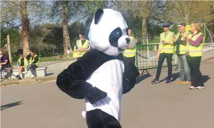  ??  ?? Runner and Guardian writer Kate Carter pictured running in a panda suit during a Parkrun event.Carter hopes to break the world record for fastest marathon in an animal costume. Photograph: Courtesy of Kate Carter