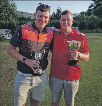  ??  ?? Whiting Bay winners: Scott Murray with the Bank of Scotland Cup and Cameron Hill with the Royal Bank of Scotland Cup.