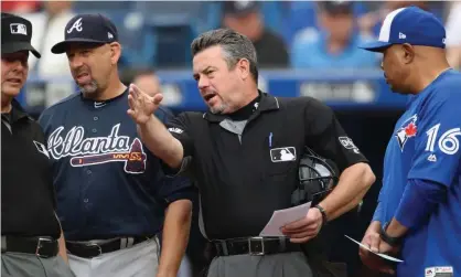  ??  ?? Rob Drake goes over the ground rules before a 2018 game between the Atlanta Braves and Toronto Blue Jays. Photograph: Tom Szczerbows­ki/Getty Images