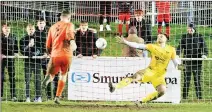  ??  ?? SPOT ON: Deal keeper Jamie Tonkin scores the winning pen