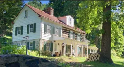  ?? SUBMITTED PHOTO ?? The log portion of the farmhouse on the former Hall family’s Christmas tree farm is the oldest building in Concord and dates back to the years 1660-1683. Concord Township will soon purchase some of the family’s property to preserve as open space.