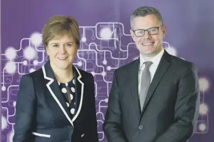  ??  ?? 0 First Minister Nicola Sturgeon and finance secretary Derek Mackay had reason to be upbeat over GERS figures