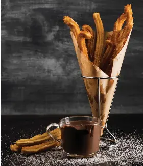  ??  ?? Chocolate with churros is a typical dish of Madrid's gastronomy.