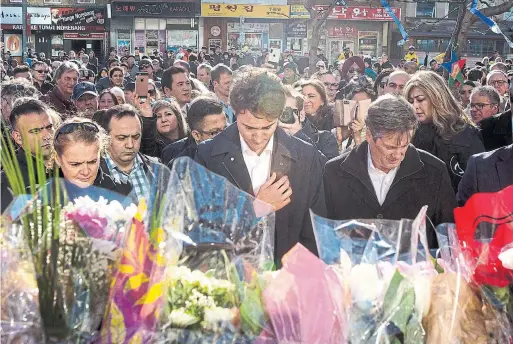  ?? CHRIS YOUNG/THE CANADIAN PRESS ?? Gov. Gen. Julie Payette, Prime Minister Justin Trudeau and Mayor John Tory visit a memorial wall for the victims of the Yonge St. van rampage before Sunday’s vigil.