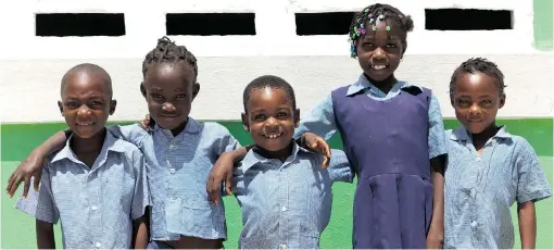  ?? PHOTOS: MICHAEL RAJZMAN ?? Children in Dos Palais, Haiti are proud of their school, built with funds raised by Canadian students.