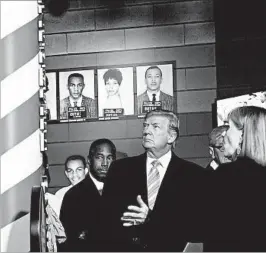  ?? SUSAN WALSH/AP ?? HUD Secretary Ben Carson, from left, President Donald Trump and Museum Division Lucy Allen tour the newly opened Mississipp­i Civil Rights Museum on Saturday. Director