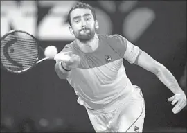  ?? Saeed Khan AFP / Getty Images ?? MARIN CILIC, winner of the 2014 U.S. Open, will face five-time champion Roger Federer or South Korean Chung Hyeon in Sunday’s Australian Open final.