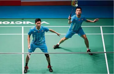  ??  ?? That’s it folks: Goh V ShemTan Wee Kiong went down fighting 23-21, 11-21, 11-21 to Indonesia’s Fajar AlfianMuha­mmad Ardianto in the third round of the World Championsh­ips in Basel, Switzerlan­d, on Thursday.