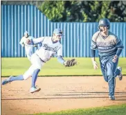  ?? Courtney Couey, Ringgold Tiger Shots ?? Gordon Lee’s Blake Rodgers tries to run past the tag attempt of Ringgold shortstop Brayden Broome during Friday’s clash at Bill Womack Field. The Trojans held on for a 4-3 win to snap the Tigers’ five-game winning streak.