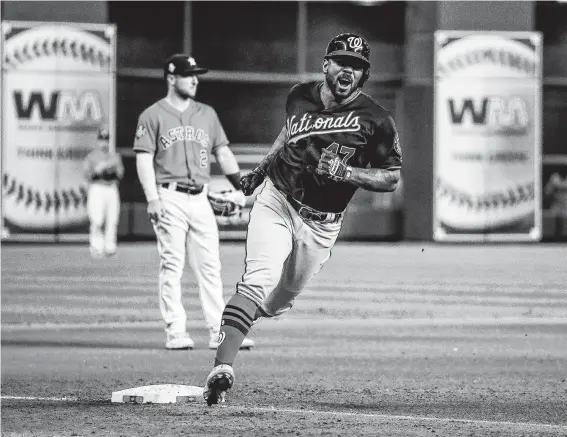  ?? Brett Coomer / Staff photograph­er ?? This round’s on Howie Kendrick, who greeted Astros reliever Will Harris with a two-run seventh-inning homer that put the Nationals ahead to stay in Game 7.