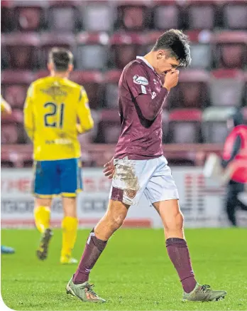  ??  ?? Hearts’ Aaron Hickey can’t hide his disappoint­ment as he trudges off at full-time