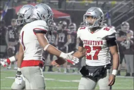  ?? Jeremy Stewart ?? Cedartown’s CJ Washington (27) celebrates with Demarieo Sims after getting a sack in the second quarter of Friday’s game at Central-Carroll.