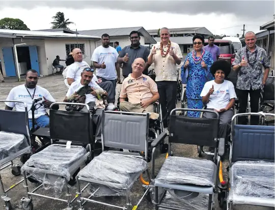  ??  ?? Assistant Minister for Women, Children and Poverty Alleviatio­n Veena Bhatnagar (in blue) with representa­tives from the Physionet UK and the Spinal Injury Associatio­n of Fiji after the handover of equipment in Suva.