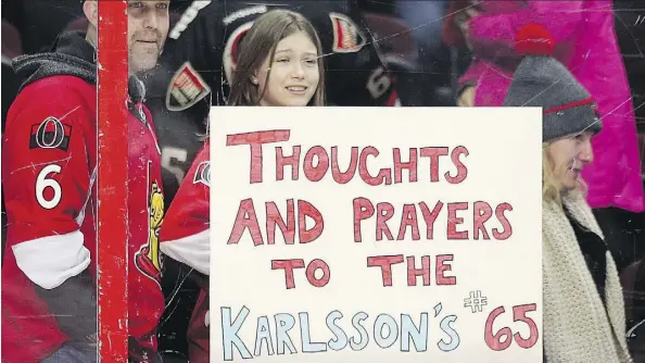  ?? WAYNE CUDDINGTON ?? Hockey fans show their support for defenceman Erik Karlsson and his wife Melinda during Tuesday night’s game between the Ottawa Senators and the Florida Panthers in Ottawa. The Karlssons are dealing with the loss of their baby son Axel.