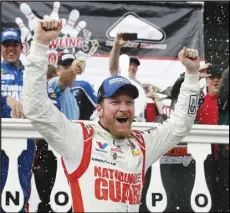  ?? Associated Press ?? HALL OF FAMER — In this Aug. 3, 2014, file photo, Dale Earnhardt Jr. celebrates in Victory Lane after winning a NASCAR Sprint Cup Series race at Pocono Raceway in Long Pond, Pennsylvan­ia. The longtime fan favorite was one of three people elected to NASCAR’s 2021 Hall of Fame class on Tuesday.