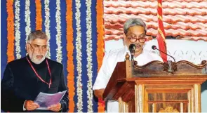  ?? - PTI ?? SWEARING-IN CEREMONY: BJP leader Manohar Parrikar taking oath as Goa’s new chief minister at a swearing-in ceremony in Panaji on Tuesday.