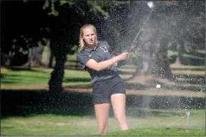  ?? COURTESY PHOTOS/DWIGHT OTA ?? Above: Tokay's Annika Hauschildt hits out of the bunker on the seventh hole during Monday's TCAL Tournament at Elkhorn Golf Club in Stockton. Below: Tokay's girls golf team after winning on Monday. From left to right: Emma Jellen, Aleesa Ohata, Elisa Cabrera, Hannah Hauschildt, Annika Hauschildt and Mariko Hashimoto.