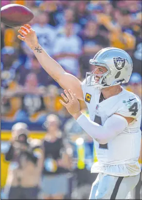  ?? Heidi Fang Las Vegas Review-journal @Heidi Fang ?? An Arizona gambler picked all 14 NFL winners — at 4,200-1 odds — including the underdog Raiders and quarterbac­k Derek Carr.