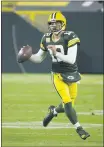  ??  ?? MIKE ROEMER — THE ASSOCIATED PRESS Green Bay Packers quarterbac­k Aaron Rodgers (12) looks to throw during the second half of the game against the Atlanta Falcons on Monday, in Green Bay, Wis.