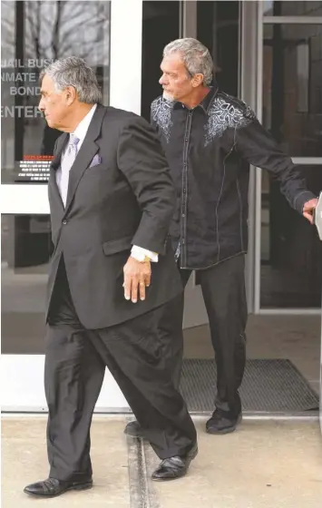  ?? ALAN PETERSIME, AP ?? Attorney James Voyles, left and Colts owner Jim Irsay leave Hamilton County Jail in Indianapol­is on Monday. Irsay was charged with DUI and possession of a controlled substance.