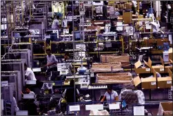  ?? TRIBUNE NEWS SERVICE FILE PHOTOGRAPH ?? Workers in the auto parts production line of the Bosch factory in San Luis Potosi, Mexico, on Jan. 11, 2017.