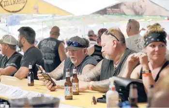  ?? STEPHEN GROVES/AP 2020 ?? Bikers congregate at One-eyed Jack’s Saloon last year during the annual Sturgis Motorcycle Rally in South Dakota. The annual rally begins Friday, and health experts fear the gathering will lead to a surge in coronaviru­s cases.