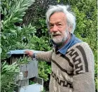  ??  ?? Alan Bagnall next to the battery housing for his electric deer fence.