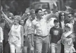  ?? JUSTIN TANG, THE CANADIAN PRESS ?? Justin Trudeau with Kathleen Wynne, left, in the Ottawa Capital Pride parade. Margaret Shkimba argues the two Liberal government­s aren’t concerned about fairness.