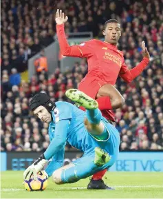  ?? - AFP photo ?? Arsenal’s Czech goalkeeper Petr Cech saves at the feet of Liverpool’s Dutch midfielder Georginio Wijnaldum during the English Premier League football match between Liverpool and Arsenal at Anfield in Liverpool, north west England on March 4, 2017....