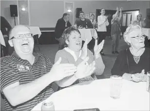  ?? DAVID BEBEE WATERLOO REGION RECORD ?? Bill Thiessen, left, his wife Ruthanne and her mother Joan Poyntz celebrate as PC candidate Amy Fee takes the lead in the riding of Kitchener South-Hespeler.