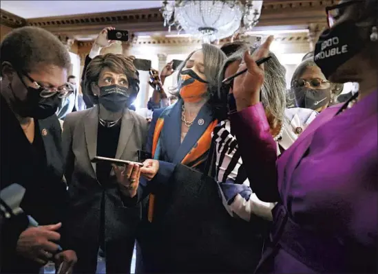  ?? Chip Somodevill­a Getty Images ?? CONGRESSIO­NAL BLACK CAUCUS members including Los Angeles Reps. Karen Bass, left, and Maxine Waters, second from left, watch the verdict at the Capitol.