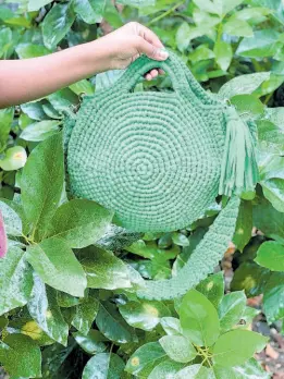  ?? ?? One of Yoma Craft’s earlier creations, this green Layla Circle Bag is a best seller.