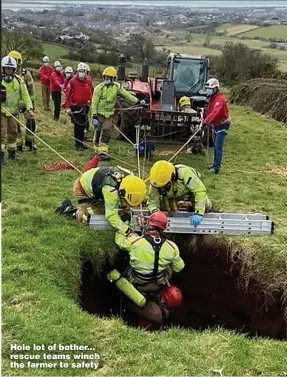  ??  ?? Hole lot of bother... rescue teams winch the farmer to safety