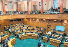  ?? Photo / Eugenie Sage ?? Members of the 2022 Youth Parliament take their seats in the debating chamber yesterday.