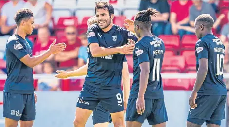  ?? Pictures: SNS Group. ?? Dundee’s Sofien Moussa celebrates a goal with his team-mates.