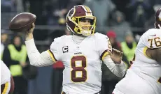  ?? STEVE DYKES/GETTY IMAGES ?? Quarterbac­k Kirk Cousins says he will file a grievance through the NFL players’ union if the Washington Redskins try to put a franchise tag on him.