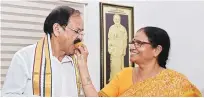  ?? PHOTO: PTI ?? Union Minister M Venkaiah Naidu being offered sweets by his wife Usha at his home after he was announced as the NDA’s vice-presidenti­al candidate in New Delhi on Monday