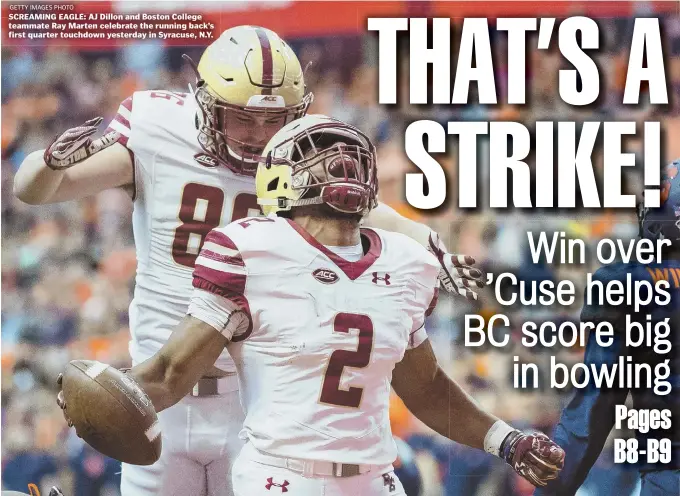  ?? GETTY IMAGES PHOTO ?? SCREAMING EAGLE: AJ Dillon and Boston College teammate Ray Marten celebrate the running back’s first quarter touchdown yesterday in Syracuse, N.Y.