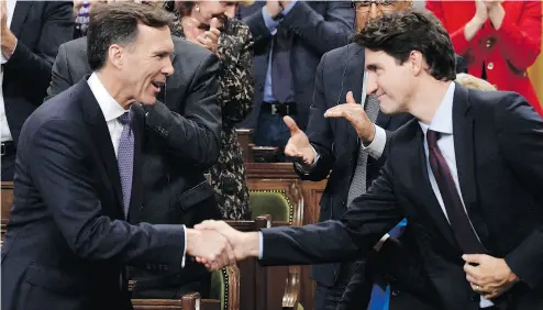  ?? ADRIAN WYLD / THE CANADIAN PRESS FILES ?? Finance Minister Bill Morneau with Prime Minister Justin Trudeau after delivering his fall economic statement.