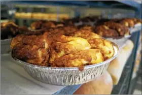  ?? PHOTO BY EMILY RYAN ?? Monkey bread cools on a shelf at Spring Mill Bread Co.