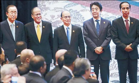  ?? AP ?? From left, United Nations Secretary General Ban Ki-moon, President Aquino, Myanmar President Thein Sein, Japanese Prime Minister Shinzo Abe and Indonesian President Joko Widodo pose for photograph­s during the 10th East Asia Summit, held alongside the...